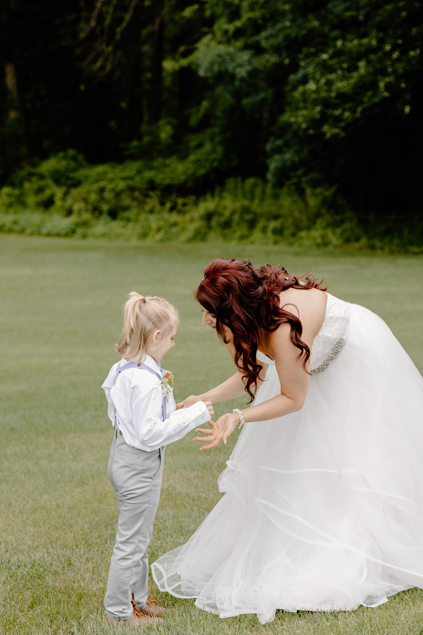 bride holding hands with her son