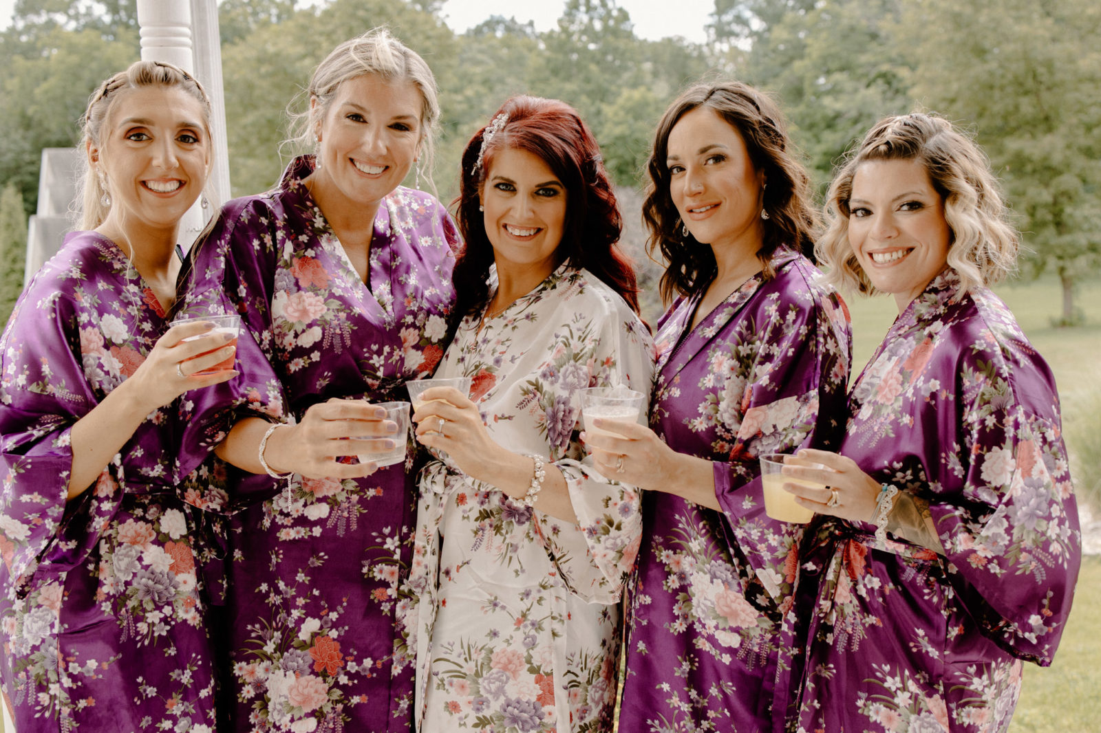 bride and bridesmaids in floral robes